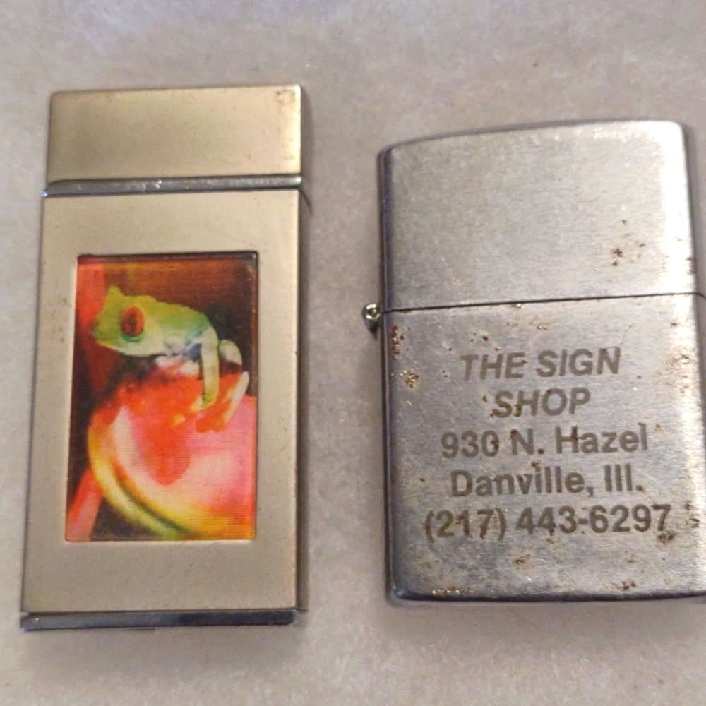 Two vintage lighters both need fluid